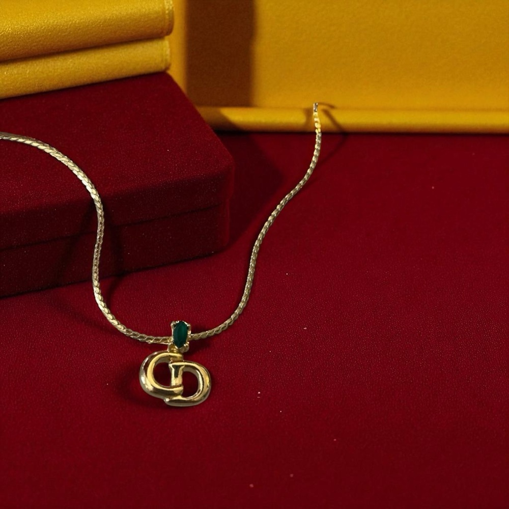 Christian Dior Gold Necklace with Gold and Green Emerald Accent